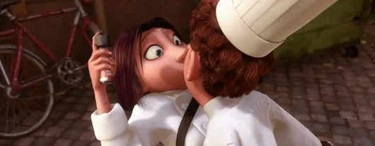 scène du dessin animé "Ratatouille" représentant Linguini qui vole un baiser à Colette.